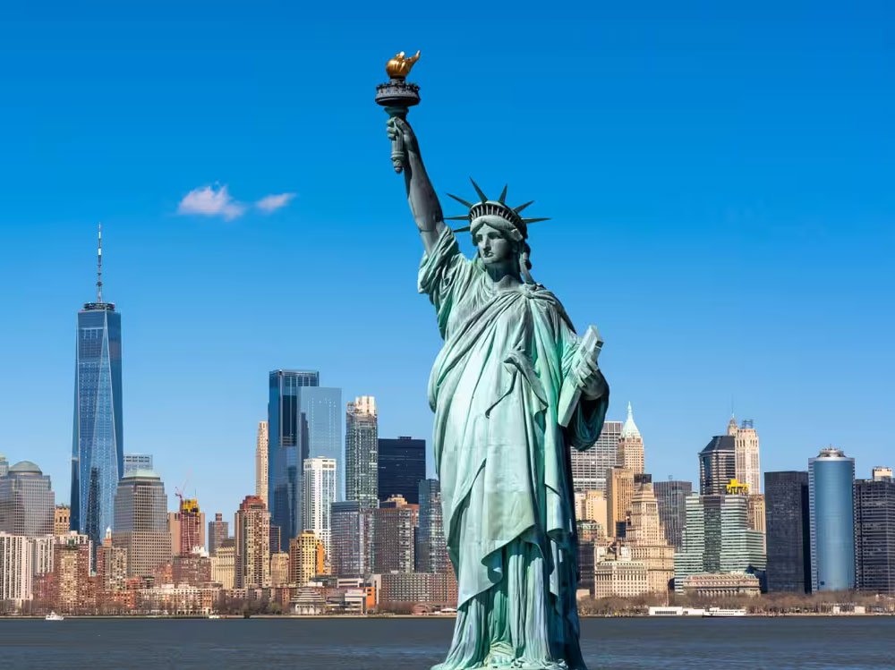 Book cheap flight to New York City skyline with Statue of Liberty USA